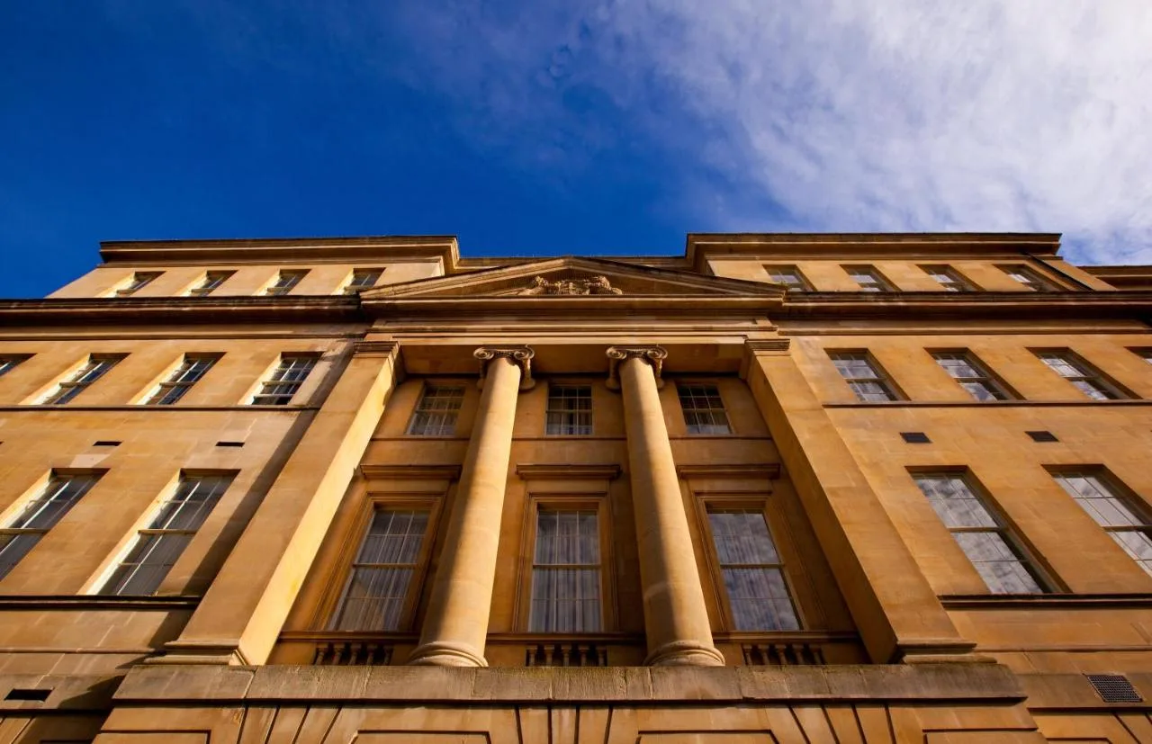 a tall building with columns on top of it at The Gainsborough Bath Spa in Bath